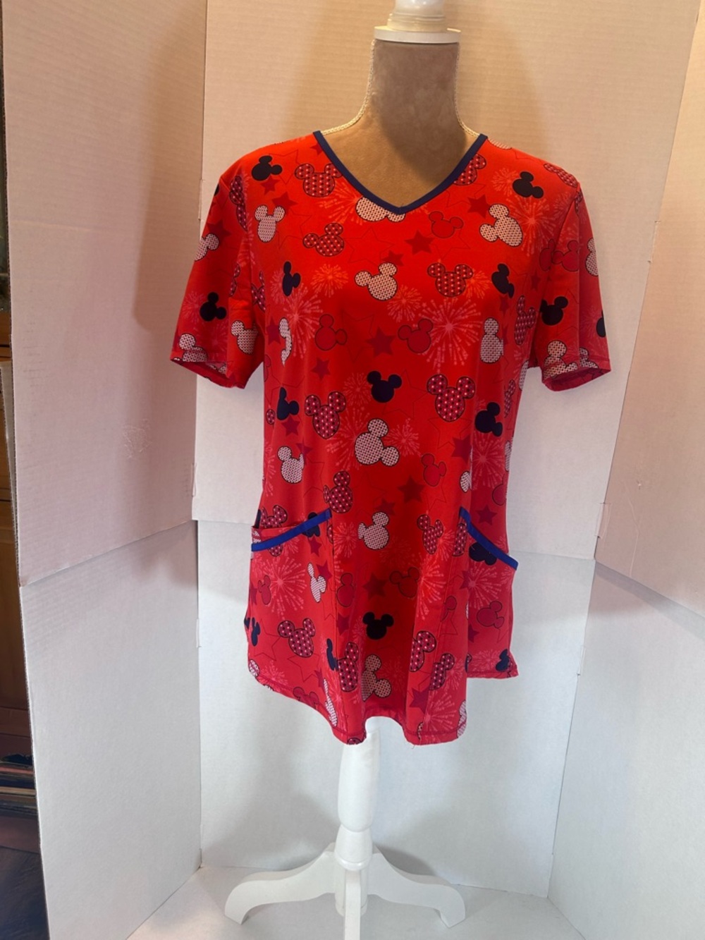 Disney Red Short Sleeve V-Neck scrub top with Navy Trim and Mickey Motif
